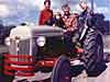 John Gustafson's 1950 8N. This a photo taken in fall of 1950 of their new 1950 8N.  John is on the left, his Dad at the wheel with cousin Gail,  brother Matt on the right.  Towing an old stone behind.